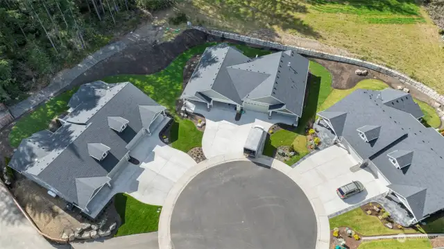 This home is the 3rd from the left in this aerial photo. See the large side yard.