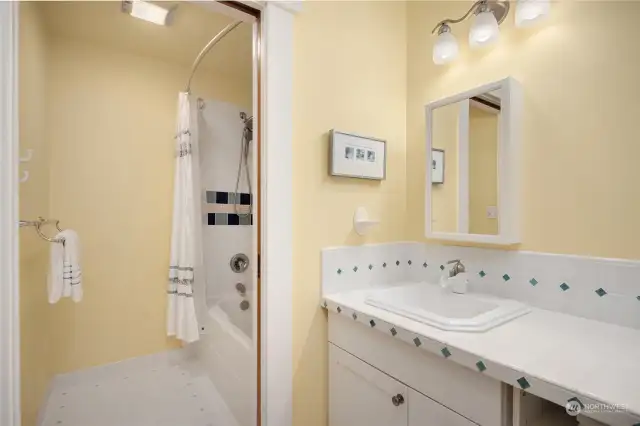 The second full bath is convenient to both the second and third bedrooms.