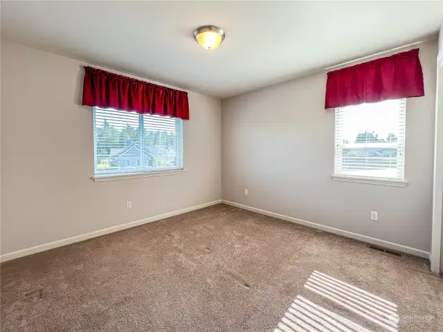 Spacious upper 4th Bedroom with access to 3/4 bath across hallway.