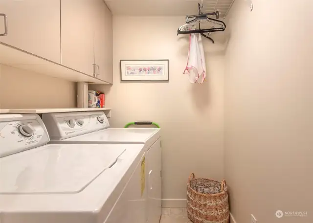 Spacious Utility room with full size washer and dryer.
