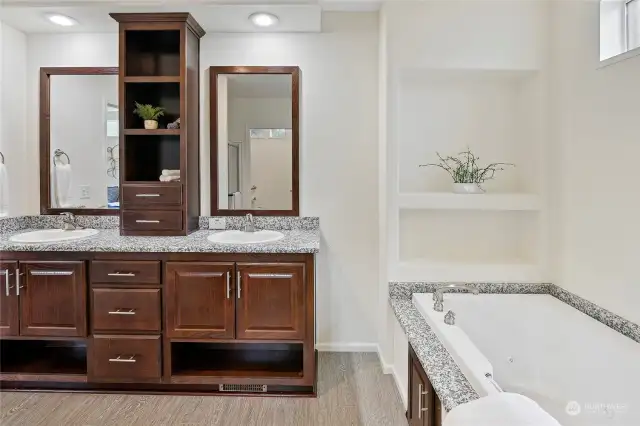 Oooh and Aaah, your ensuite is your private spa-like sanctuary! It boasts gorgeous granite --both on the tub surround AND the counters, plus beautiful cabinetry with a modern aesthetic.