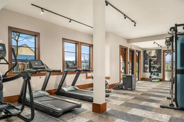 Nicely equipped fitness room on lower level of community clubhouse