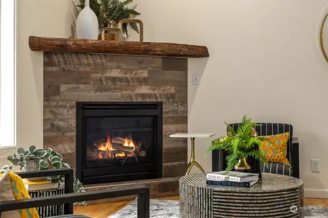 The efficient propane fireplace with custom surround and mantel.