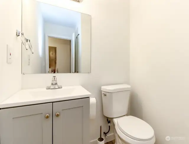 1/2 bathroom located on the main level of the condo
