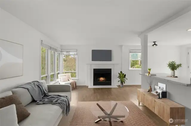 This one-story home boasts a maximized layout with a mantled fireplace in the living room, generously sized bedrooms, and French doors that lead to a patio with seating! This photo is virtually staged.