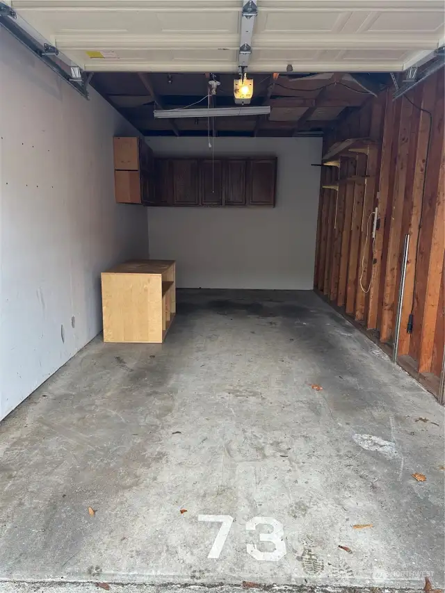 Deep garage with storage cabinets