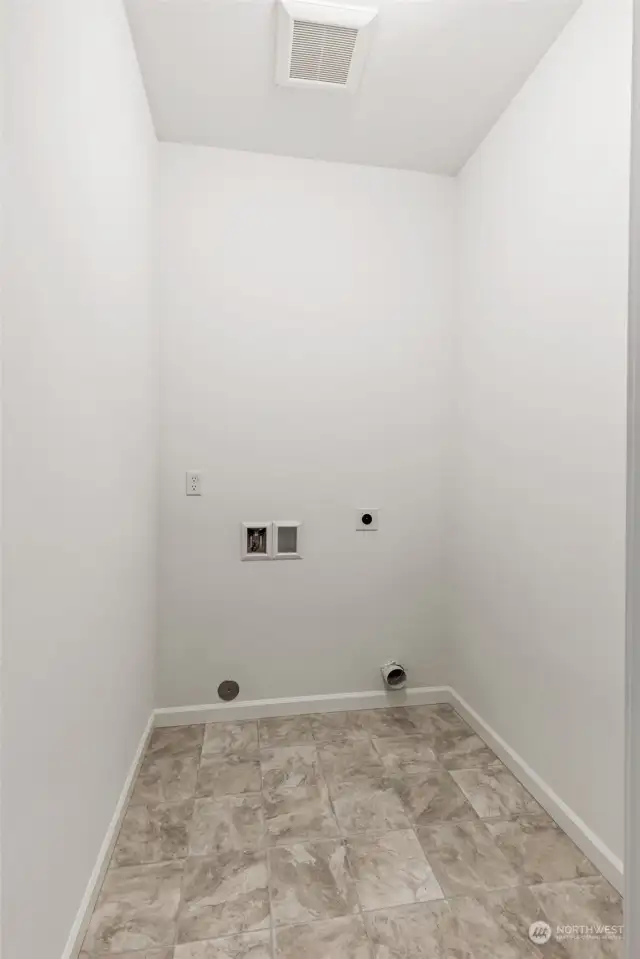 Lower floor laundry!!!  **Photos is a representation only. This is the same floorplan in the community, but a different homesite. Colors and features will vary**