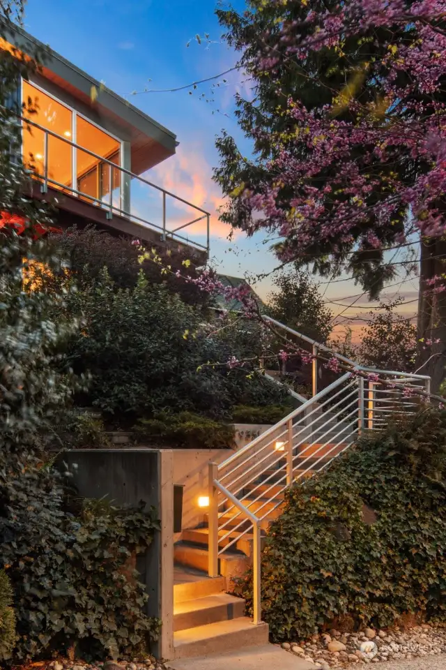 Lighted staircase, there is also alley access where you can drive right in to your garage. You're going to love the tranquil setting with all the modern amenities.