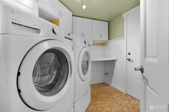 Large utility room on main floor that leads into garage.  Washer & dryer included.