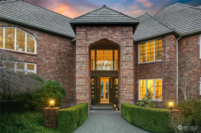 Stately, oversized, custom double-door entry with a soaring, two-story welcome.