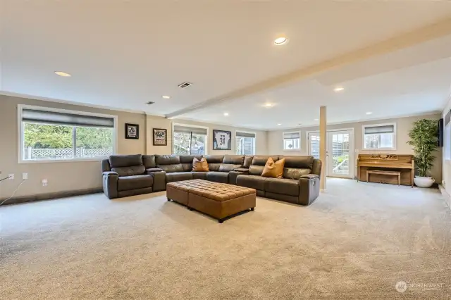 GIGANTIC FAMILY/GREAT ROOM ON LOWER-FLOOR W/ NATURAL LIGHT, FRENCH DOORS TO BACK YARD & SPACE FOR ANYTHING. (SELLER IS LEAVING THE SOFA WITH THE HOUSE CAUSE ITS PERFECT FOR THIS ROOM.)