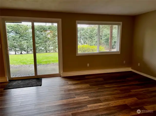 Family room on lower level has upgraded vinyl plank flooring.