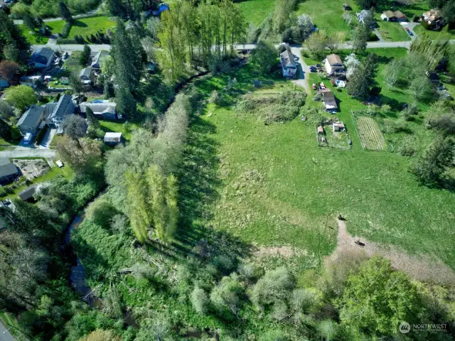 Aerial view of the vacant land and surrounding neighborhood.