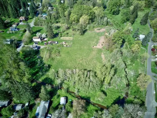 Aerial view of the vacant land and surrounding neighborhood.