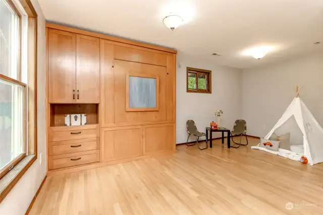 The Murphy bed pulls down easily or goes back up when space is needed.