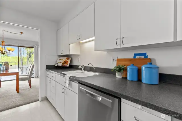 Bright, airy kitchen offers plenty of storage and workspace, making it the perfect setting for preparing meals