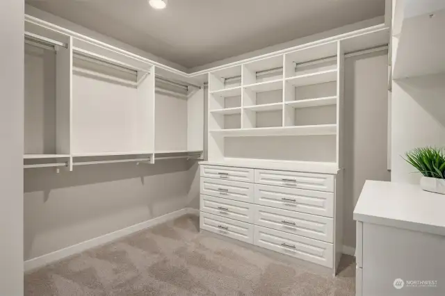 A brand-new custom walk-in California Closet with custom drawers and thoughtful touches (2021). Smart wired panel also located in closet