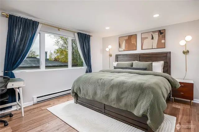 Very large bedroom, with western view window, engineered hardwoods AND elegant and upscale built-in style closets.