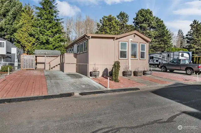 180 day lot park model with permitted addition offering ample entertainment, lounging and sleeping quarters! "AS is" sale with seller moving out of state