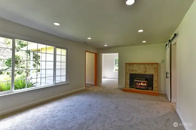 Living room with propane FP, open to nice den