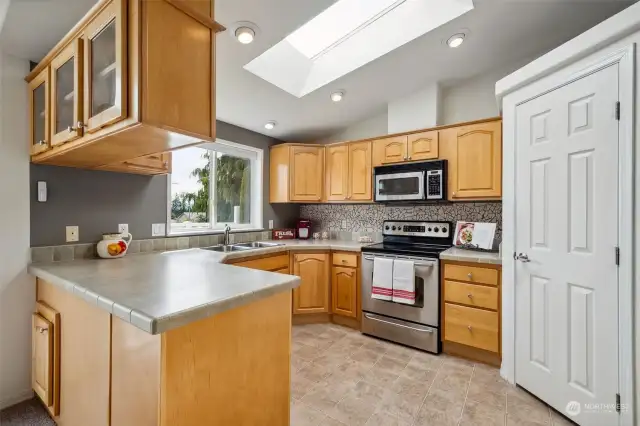 Kitchen with stainless stainless steel appliances and pantry
