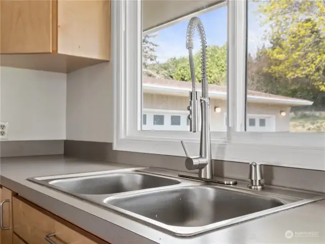 Double sinks and a new faucet complement this kitchen.