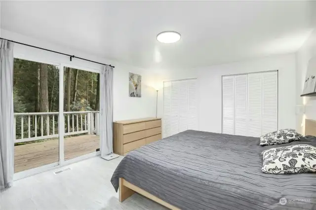 Primary bedroom with access to the expansive back deck.