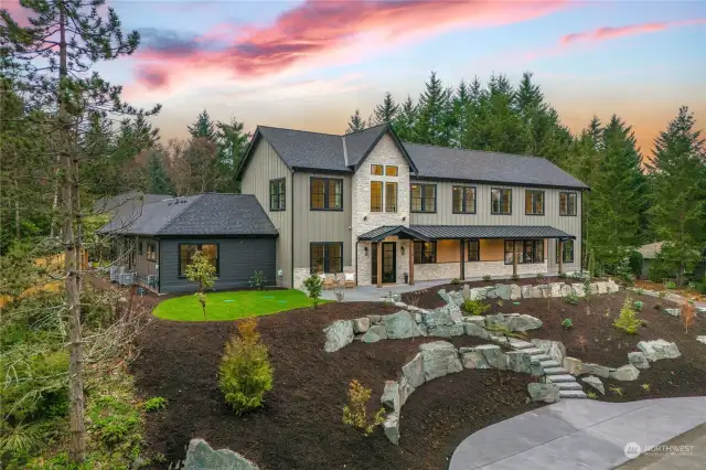 Welcome to an exclusive opportunity in Gig Harbor's coveted Canterwood Golf and Country Club. This Northwest Contemporary masterpiece boasts unparalleled luxury and modern elegance.
