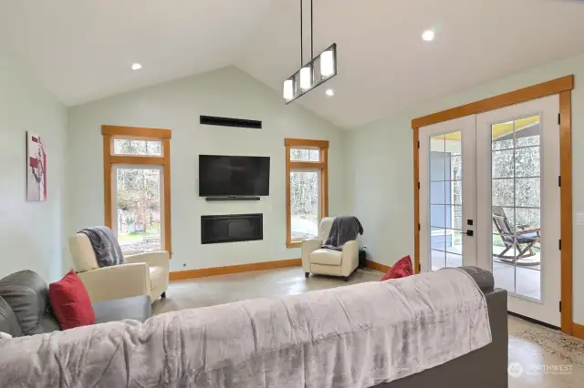 Vaulted ceiling and French doors with a gas fireplace to keep you warm.