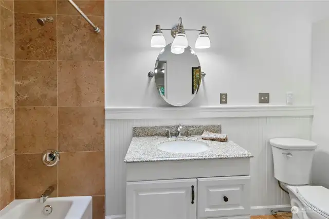 Bright and white.  The main bathroom also has a skylight