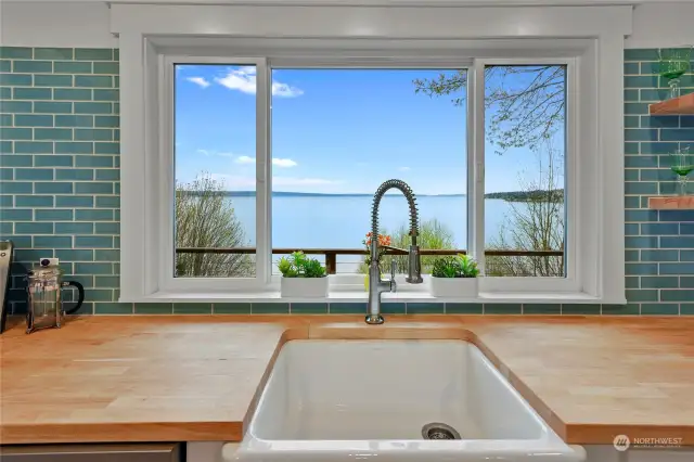 I'd do dishes all day with this view using a gorgeous farmhouse sink