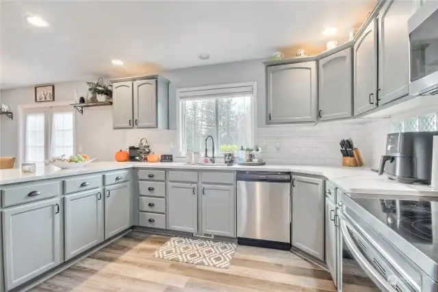 Full height backsplash complements this kitchen.