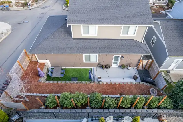 Aerial view of the back exterior with a low maintenance yard.