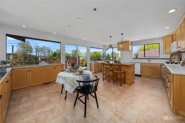 Expansive kitchen with access to full length deck, located just off the living room