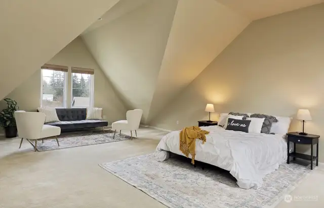 We are upstairs in the loft bedroom (3rd bedroom) with vaulted ceilings, skylights and its own full bath.