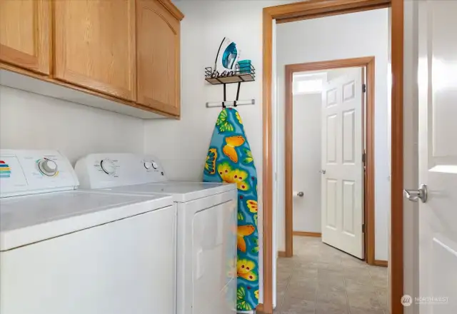 Laundry room connects to primary bath and main hallway.