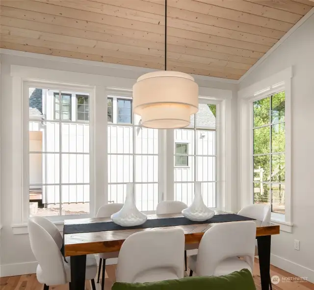Dining space is roomy and comfortably accomodates a large family dinner.