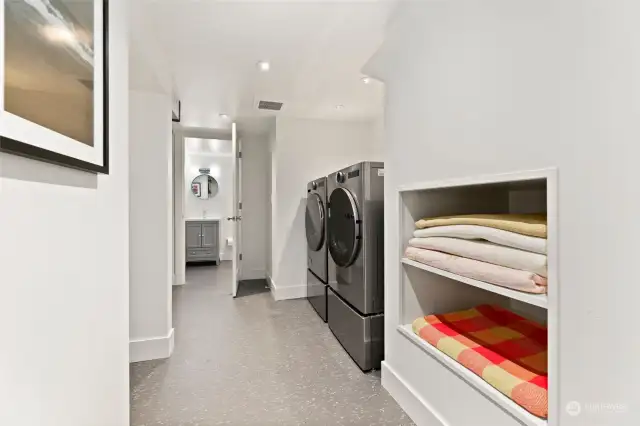 Handsome graphite, LG full size washer and dryer (on pedestal storage boxes!) are a dream for laundry chores.