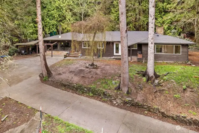 You'll love the privacy of this home and acreage nestled in the woods at the end of a dead-end road. They don't build mid-century homes like this any longer!
