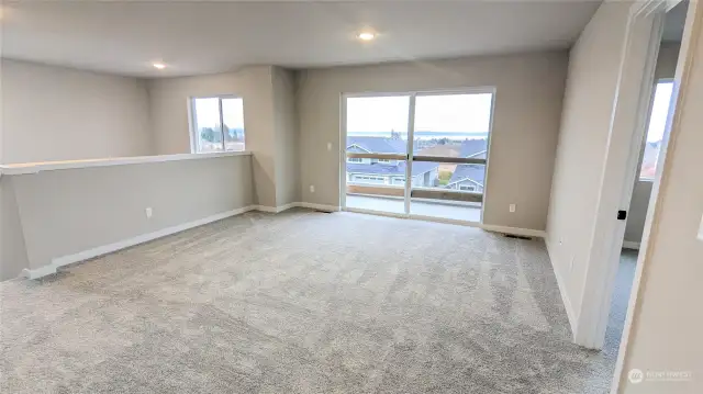 Bonus Room on Upper Level with slider to covered deck  - Photos from finished Ellington on another lot in community. Finishes and options will vary.