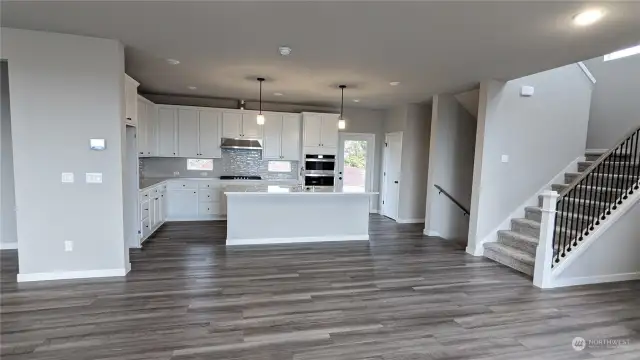 Kitchen from Great Room  - Photos from finished Ellington on another lot in community. Finishes and options will vary.