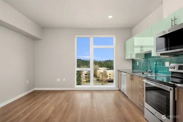 Top floor, bright with open view. Floor-to-ceiling oversized windows let in lots of natural light.