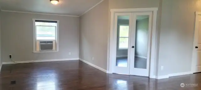 BONUS ROOM Alert! Behind The Glass French Doors a Large Bonus Room! Window AC Cools House Efficiently Stays With The Home!