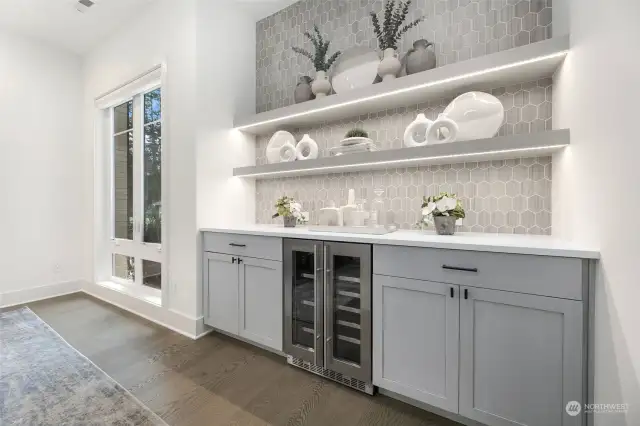 Built-In Buffet w/ Tile Accent Wall, Beverage Center + Under Shelving Lighting.
