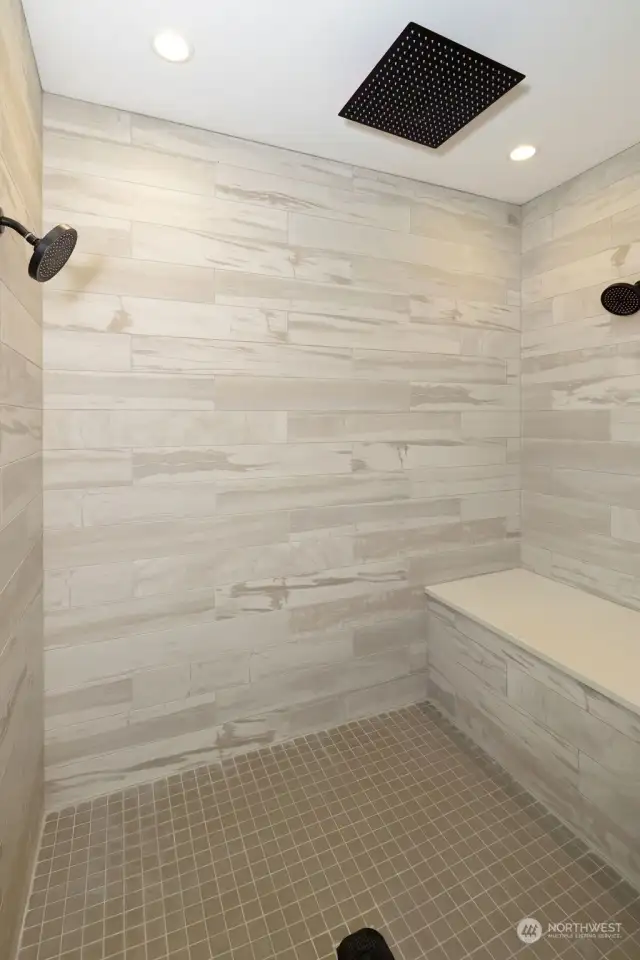 Here's your Walk-in Shower, with a tile bench and dual shower heads plus a ceiling rain shower head!
