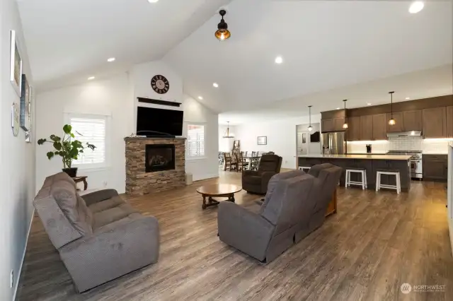 With the easy flow of the home's great room open concept design, you can join your guests at the breakfast bar, and still keep an eye on the activities in the kitchen, living area and yard.