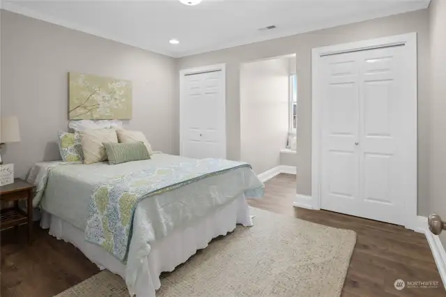 One of three bedrooms on the upper level. This one features double closets and newly installed luxury plank vinyl flooring.