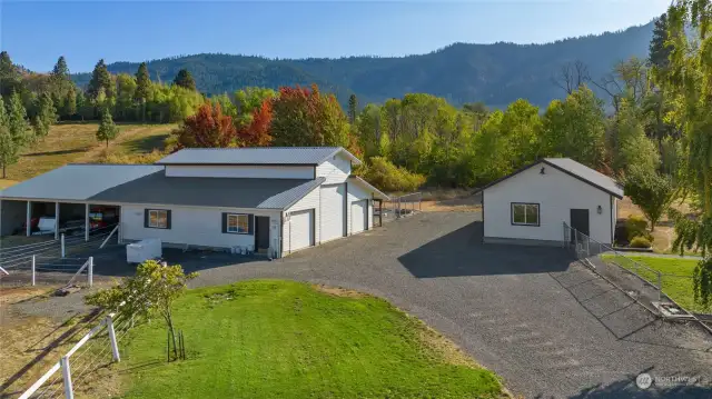 A spacious three-bay barn with the potential for six stalls, as well as a two-bay outbuilding/shop, are included on the property.