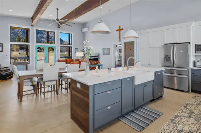 The layout features an open concept design seamlessly connecting the kitchen to the dining and living areas. Positioned on the right side is the primary suite, while the office and guest room are situated on the opposite side.