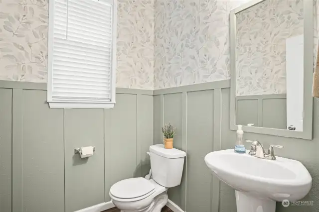 A convenient and spacious main level powder room. Ideal for guests and for its location to the home office / den.